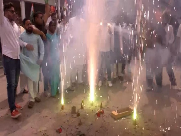 Assam Congress workers bursting crackers in Guwahati (Photo/ANI)