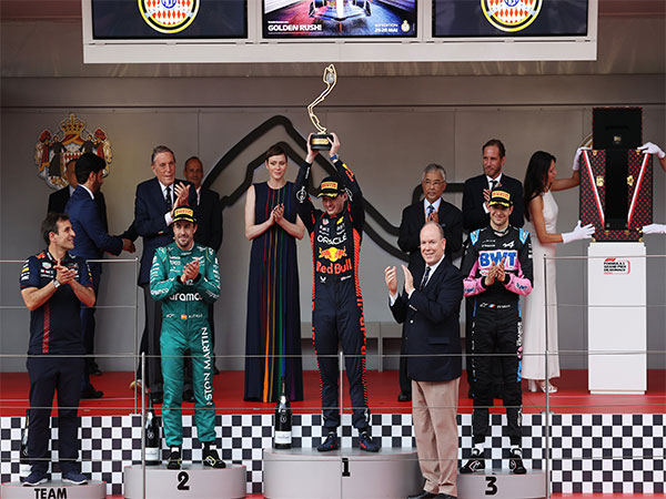 Max Verstappen (in middle with trophy) (Photo: Oracle Red Bull Racing/ Twitter)