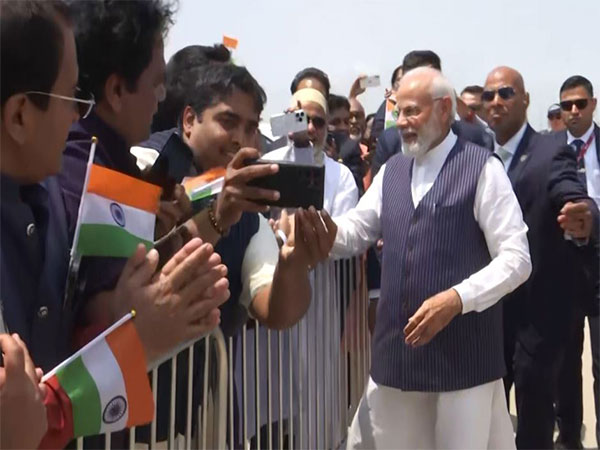 PM Modi interacting with Indian diaspora at airport (Photo/ANI)