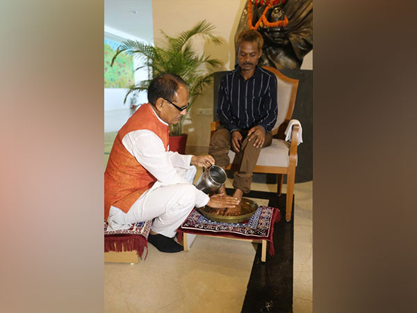 CM Shivraj Singh Chouhan washes feet of urination case victim in Bhopal. (Photo/ANI)